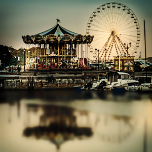 image from "Honfleur boat harbor with ferris wheel and merry-go-round" by kfphotography